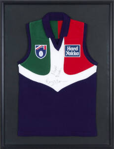 FREMANTLE: Fremantles first jumper (1995-2000) signed by Ben Allan & Matt Burton (first captain & vice-captain), framed & glazed, overall 71x93cm.