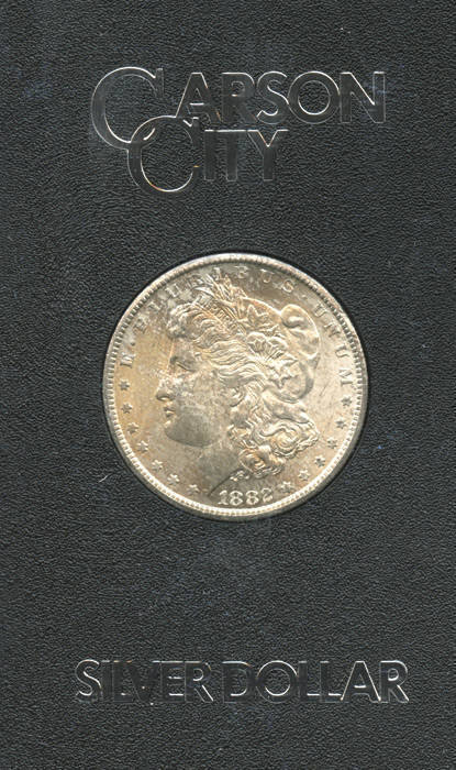 1882 cased Carson City Morgan silver dollar. From part of the hoard discovered during a 1964 Treasury Audit. Selling regularly on USA e-bay at $150 to $300. With USA Government numbered certificate.