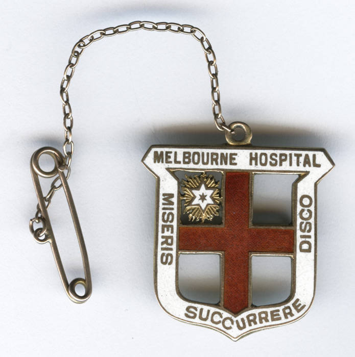 MELBOURNE HOSPITAL, 15ct gold & enamel badge Melbourne Hospital/ Miseris Succurrere Disco", engraved on reverse "E.G.Gooden, 17'6'28". Weight 9.39 grams.