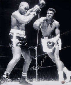 MUHAMMAD ALI, signed photograph from the Muhammad Ali vs Doug Jones fight, March 13th 1963, size 40x51cm. With 'Online Authentics' No.9667.