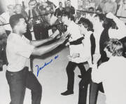 MUHAMMAD ALI & THE BEATLES, photograph of Ali clowning around with The Beatles, signed "Muhammad Ali", size 51x40cm. With CoA.