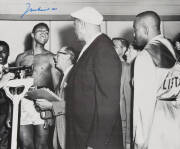 MUHAMMAD ALI, signed b/w photograph of Ali at weigh-in with Sonny Liston, size 51x41cm. With CoA.
