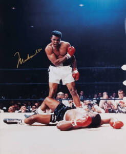MUHAMMAD ALI, signed colour photograph of Ali standing over Sonny Liston, size 41x51cm. With CoA.