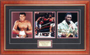 MUHAMMAD ALI v JOE FRAZIER, display comprising action photograph signed by both fighters, window mounted with another photograph of each fighter, framed & glazed, overall 89x54cm. With CoA.