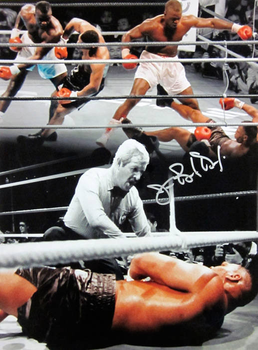 JAMES "BUSTER" DOUGLAS, signed colour photograph of his stunning upset when he knocked out previously undefeated champion Mike Tyson in 1990, size 30x41cm.