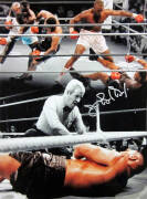 JAMES "BUSTER" DOUGLAS, signed colour photograph of his stunning upset when he knocked out previously undefeated champion Mike Tyson in 1990, size 30x41cm.