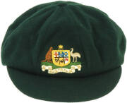 BILL WOODFULL'S AUSTRALIAN "BAGGY GREEN" TEST CAP, green wool, with embroidered Coat-of-Arms that is different to all others (similar to 1963-64). This cap bears the official Australian Coat of Arms, as set out in the 1912 Royal Warrant. It carries the ka