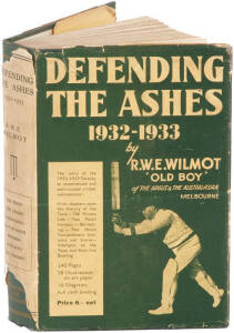"Defending The Ashes 1932-1933" by Wilmot [Melbourne, 1933], original cloth, one of the few Australian books on the 'body-line' tour, signed inside by Australian captain Bill Woodfull. Poor/Fair condition.