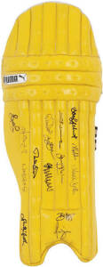 ADAM GILCHRIST'S ONE-DAY WICKET-KEEPING PAD, yellow match used "Puma" cricket pad, endorsed "Aust ODI Team to W.Indies 2003. Won Series 4-3. Also Won 21 Consecutive ODIs (Record). A.Gilchrist Pad", and signed on front by Australian team, 15 signatures inc