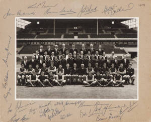 MELBOURNE: 1959 Team photograph (Premiership Year), with 20 signatures on mount, including John Beckwith (captain), Tassie Johnson, Frank Adams & Brian Dixon, overall 31x25cm.