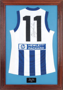 GLENN ARCHER (North Melbourne), signature on North Melbourne football jumper, framed & glazed, overall 72x103cm.