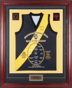 RICHMOND: Richmond Team of the Century football jumper signed by Tommy Hafey, window mounted, framed & glazed, overall 93x113cm. With CoA.