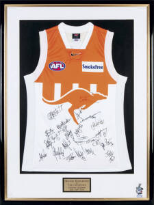 NORTH MELBOURNE: North Melbourne football jumper "Orange Kangaroos v Collingwood, Colonial Stadium, July 30th 2000", with 23 signatures, window mounted, framed & glazed, overall 80x107cm. With CoA.