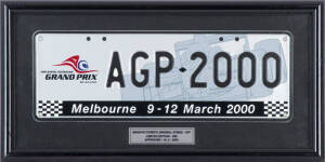 2000 AUSTRALIAN GP - COMMEMORATIVE NUMBER PLATE, "AGP-2000", manfacturer's original strike off, limited edition of 200, framed & glazed, overall 46x23cm.