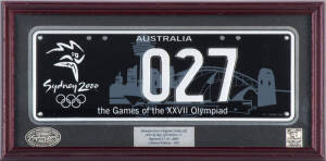 SYDNEY 2000 NUMBER PLATE, "027", manfacturer's original strike off, limited edition of 250, framed & glazed, overall 46x23cm.