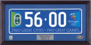 COMMEMORATIVE NUMBER PLATE, "56.00, Melbourne 1956 to Sydney 2000, Two Great Cities - Two Great Games", manfacturer's original strike off, limited edition of 500, framed & glazed, overall 46x23cm.