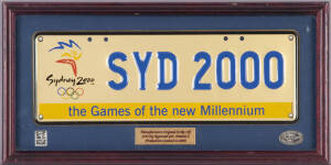 "SYD 2000" GOLD NUMBER PLATE, manfacturer's original strike off, limited to production of 2000, framed & glazed, overall 46x23cm. With CoA.