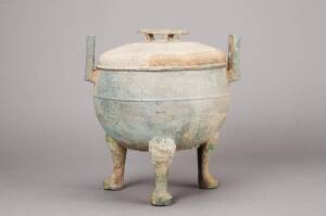 Chinese archaistic bronze ding & cover&nbsp;with upright handles, supported on three tall feet, decorated with an overall key fret design.&nbsp;28cm high, 26.4cm wide