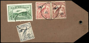 1935 (SG.205) £5 Bulolo Goldfields Airmail, VFU in combination with Undated Bird Airmails 3d, 2/- and 10/- on a complete gold bullion shipment parcel tag or label, cancelled at WAU (date indistinct). This was the purpose for which the high denomination (£