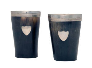 A pair of cow horn mugs with silver mounted rims & shield panels. Tallest 12.5cm