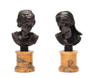 A pair of bronze busts on coloured alabaster bases. Tallest 24cm