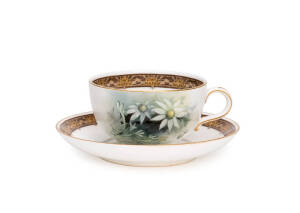 ROYAL WORCESTER: Porcelain cup & saucer, painted with Australian Flannel flowers, early 20th century