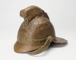 New South Wales Fire Brigade vintage brass helmet and accompanying woollen tunic. (2 items)