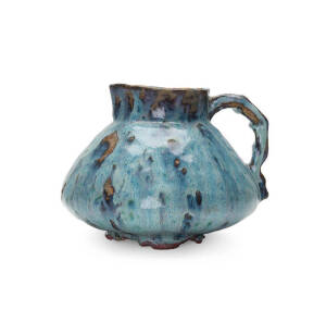 JOLLIFF: Pottery jug in blue & purple glazes, incised "Hand Built, Jolliff F.E.C. 1946". Height 15cm, width 19cm