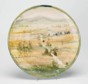 NEIL DOUGLAS Pottery plate with painted rural landscape scene. Potted by Arthur Merric Boyd. Diameter 30.5cm