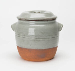 HAROLD HUGHAN: Early grey glazed terra cotta lidded jar. Full signature & incised monogram. 18cm