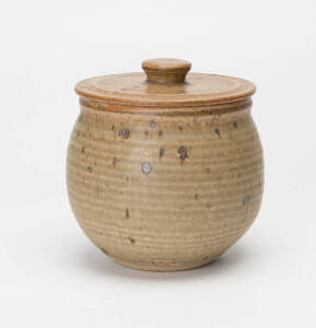 HAROLD HUGHAN: Brown glazed pottery lidded jar with full signature & incised monogram. 15cm