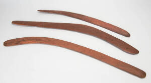 BOOMERANGS: Group of three central deserts boomerangs with ochre finish. 66cm to 80cm.
