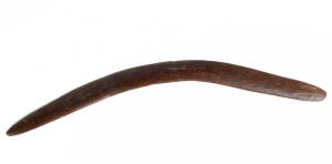 BOOMERANG: Western Australian origin, late 19th century with unusual carved motif in the centre. 65cm