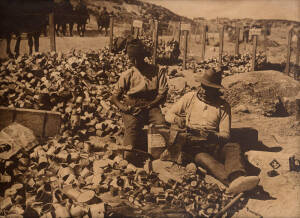 "A BOMB FACTORY", rare large format toned silver gelatin photograph, taken by renowned British War photographer Ernest Brooks (1878-1936), size 75x101cm, in original frame with archival backing. This "bomb factory" near Anzac Cove shows two Australian sol