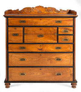 A fine Anglo-Indian campaign&nbsp;secretaire chest of 8 drawers. Teak with reeded ebony drawer blades with sandalwood secondaries. Central drawer fitted with fold out writing slope & compartments. Ornately carved gallery back. Early 19th century. Formerly the 