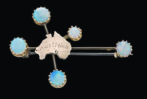 A Southern Cross opal brooch, 9ct yellow gold, makers mark indistinct, length 5cm.