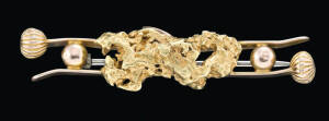A gold nugget double bar brooch, length 5cms, weight 9.72 grams.