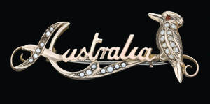 A gold, seed pearl Australia Kookaburra brooch, Duggin, Shappere and Co. Melbourne, stamped 9ct, length 4.9cm.