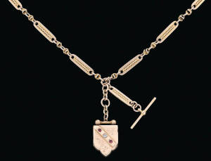 A gold watch chain and locket, Robert Robertson, Melbourne, circa 1870, marked 15ct, length 54cm, weight 60 grams.