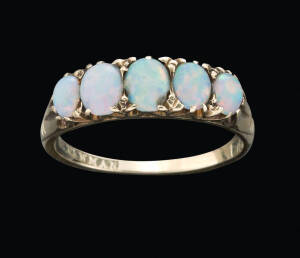An opal bridge ring by H. Newman, Melbourne, marked 18ct.&nbsp;