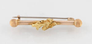 A gold nugget bar brooch, George. R. Addis, Launceston, Kalgoorlie, marked 18ct, length 4.5cm, weight 3.98 grams.