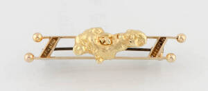 A gold nugget double bar brooch, length 4.5cm, marked 15ct, weight 9.11 grams.