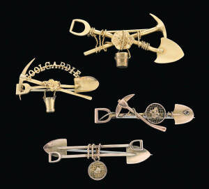Four goldfields brooches, one marked 18ct, the others not marked, length 4 - 5.5cm.