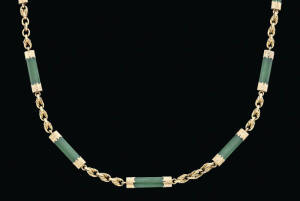A gold and New Zealand greenstone watch chain, circa 1880, marked 15ct, length 38cm.&nbsp;(Reference p.134 Australian Jewellery, 19th & 20th Century, Anne Schofield, Kevin Fahy)