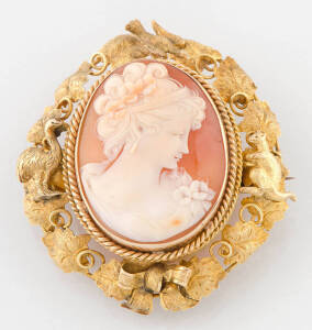 A gold foliate and helmet shell cameo brooch, applied kangaroo and emu, makers mark indistinct. (Reference p.144 Australian Jewellers, Cavill, Cocks & Grace)&nbsp;