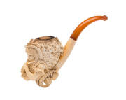 Carved Meerschaum pipe in case of a harvest scene, mid 19th century. With amber mouth piece, length 19cm.