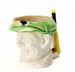DON BRADMAN TOBY JUG, with cap in green, made by Marutomo Ware, 1934, 15cm high.