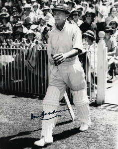 DON BRADMAN SIGNED ITEMS, noted signed photograph of Bradman walking out to bat; signed pictures (3); signed card; signed "Celebrating 100 Years of Sheffield Shield Cricket" booklets (2).