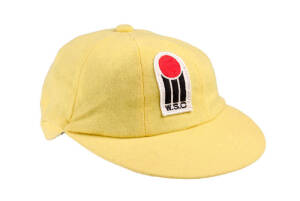 RAY BRIGHT'S AUSTRALIAN "BAGGY YELLOW" WSC CAP, yellow wool, with embroidered WSC badge (red ball over 3 black stumps & "W.S.C.") on front. Fine condition. [Ray Bright played 25 Tests & 11 ODIs 1974-86].