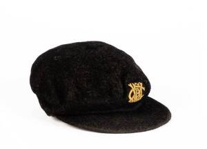 CHARLIE PUCKETT'S WESTERN AUSTRALIA CAP, black with "WACA" monogram on front, signed inside by Charlie Puckett. Fair match worn condition. [Charlie Puckett played 37 matches for WA 1939-53; and was an inaugural inductee into the Australian Baseball Hall o